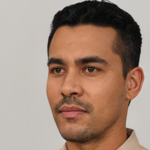 Neutral latino young-adult male with short  black hair and brown eyes