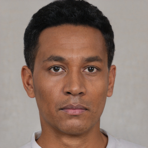 Neutral black young-adult male with short  black hair and brown eyes