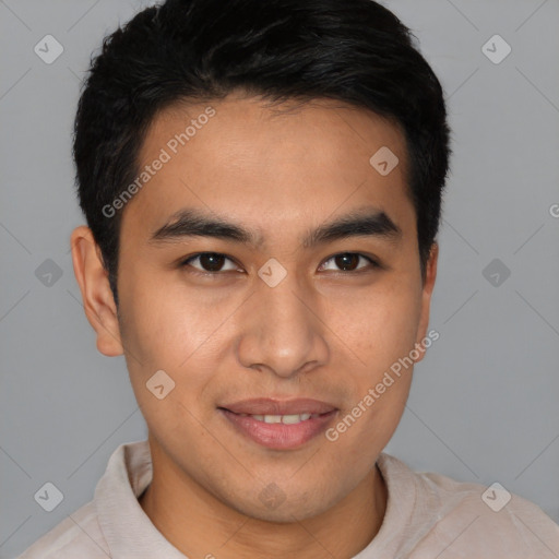 Joyful asian young-adult male with short  brown hair and brown eyes