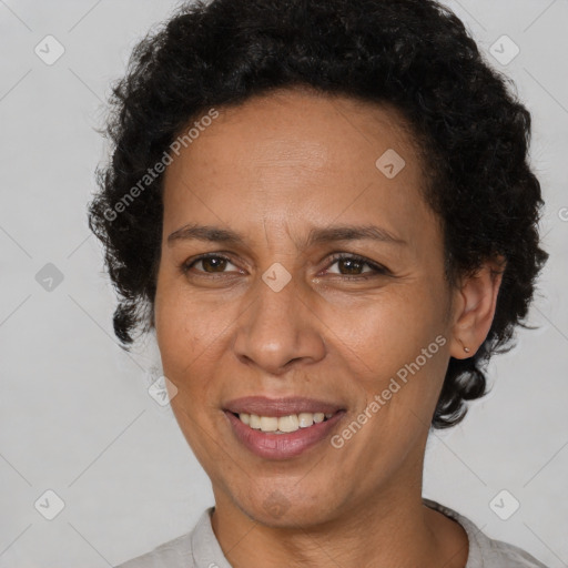 Joyful latino adult female with short  brown hair and brown eyes