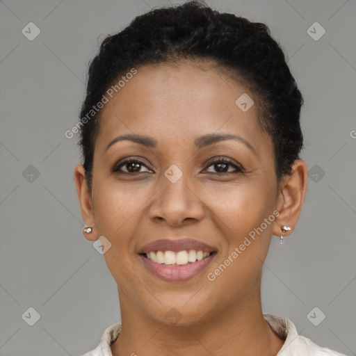 Joyful black young-adult female with short  brown hair and brown eyes