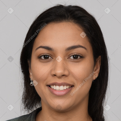 Joyful latino young-adult female with long  brown hair and brown eyes