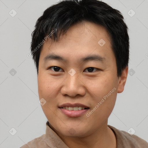 Joyful asian young-adult male with short  brown hair and brown eyes