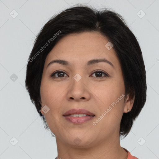 Joyful asian adult female with medium  brown hair and brown eyes