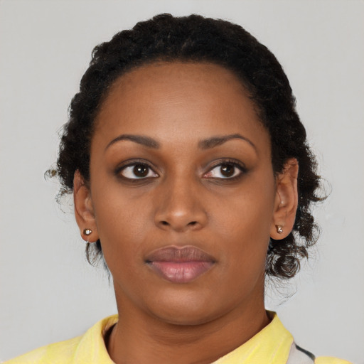Neutral black young-adult female with short  black hair and brown eyes