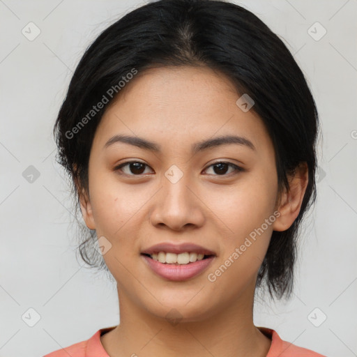 Joyful asian young-adult female with medium  black hair and brown eyes