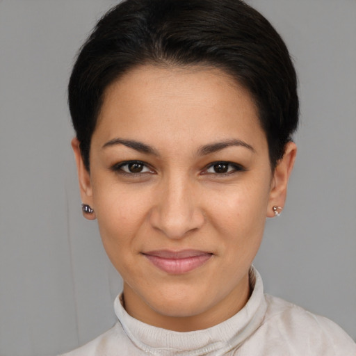 Joyful latino young-adult female with short  brown hair and brown eyes