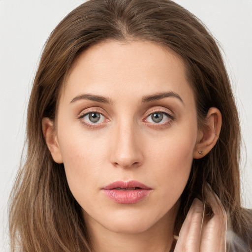 Neutral white young-adult female with long  brown hair and grey eyes