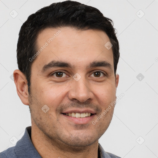 Joyful white young-adult male with short  black hair and brown eyes