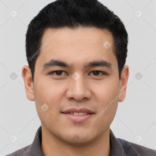 Joyful latino young-adult male with short  black hair and brown eyes