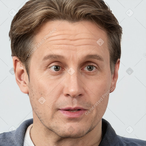 Joyful white adult male with short  brown hair and grey eyes