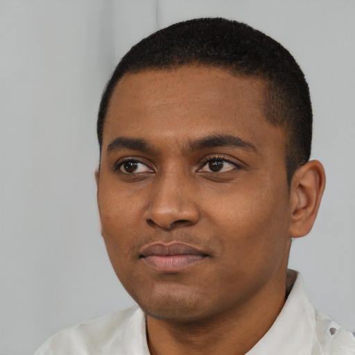 Neutral black young-adult male with short  black hair and brown eyes
