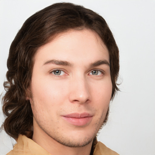 Neutral white young-adult male with medium  brown hair and green eyes