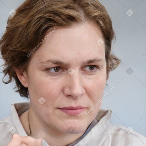 Joyful white adult female with medium  brown hair and blue eyes