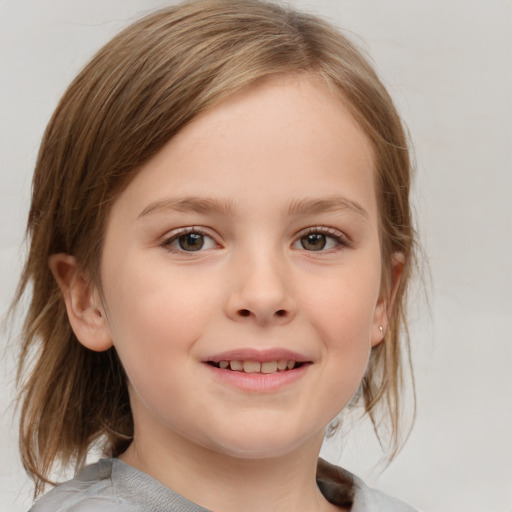 Joyful white child female with medium  brown hair and blue eyes