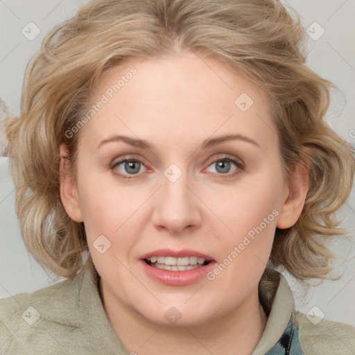 Joyful white adult female with medium  brown hair and blue eyes