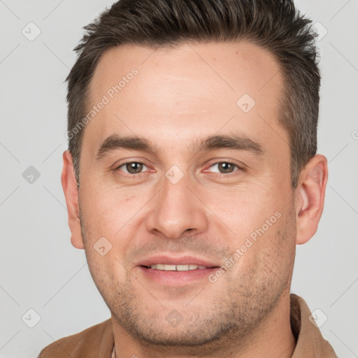 Joyful white adult male with short  brown hair and brown eyes