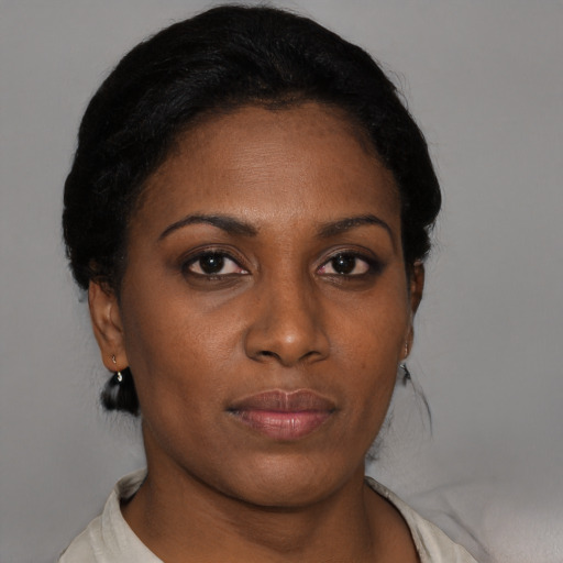 Neutral black young-adult female with short  black hair and brown eyes