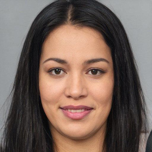 Joyful asian young-adult female with long  brown hair and brown eyes