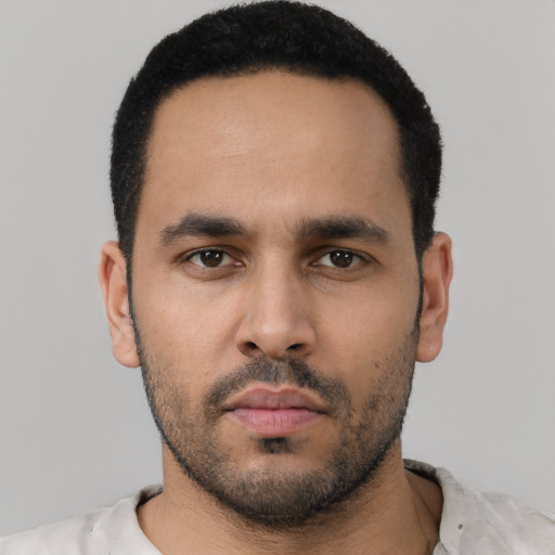 Neutral latino young-adult male with short  black hair and brown eyes