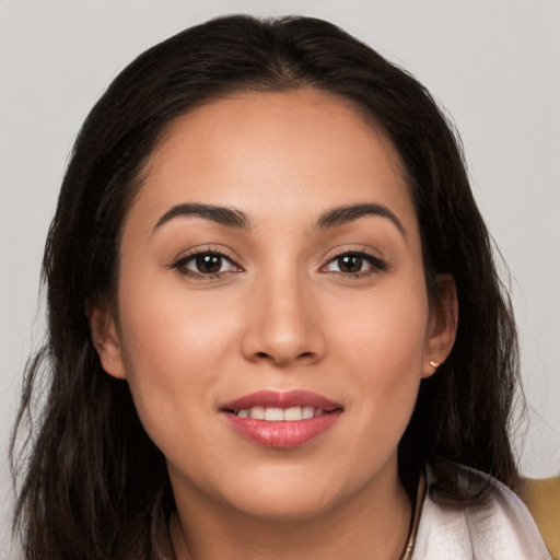 Joyful white young-adult female with long  brown hair and brown eyes