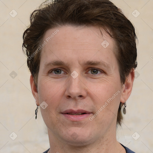 Joyful white adult male with short  brown hair and grey eyes