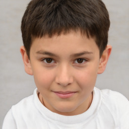 Joyful white child male with short  brown hair and brown eyes