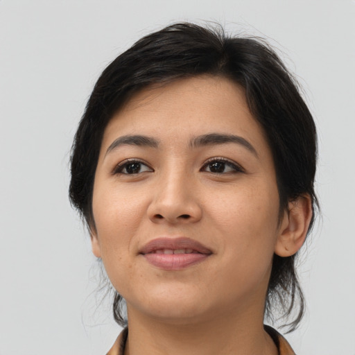 Joyful asian young-adult female with medium  black hair and brown eyes