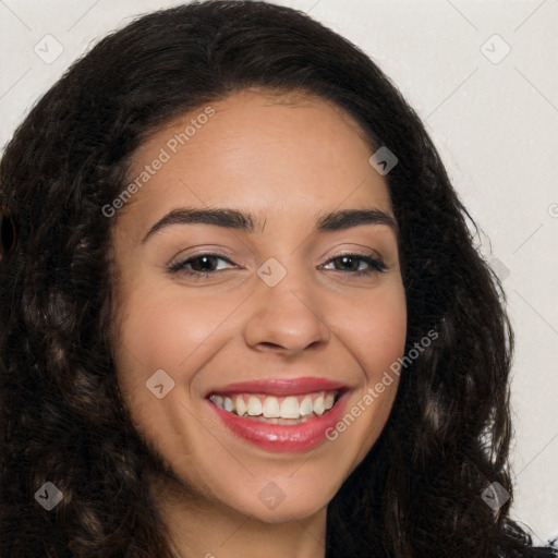 Joyful latino young-adult female with long  brown hair and brown eyes