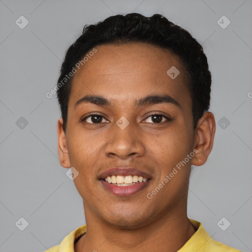 Joyful latino young-adult male with short  black hair and brown eyes