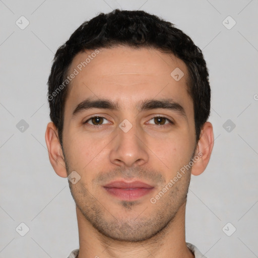 Joyful white young-adult male with short  black hair and brown eyes