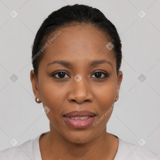 Joyful black young-adult female with short  black hair and brown eyes