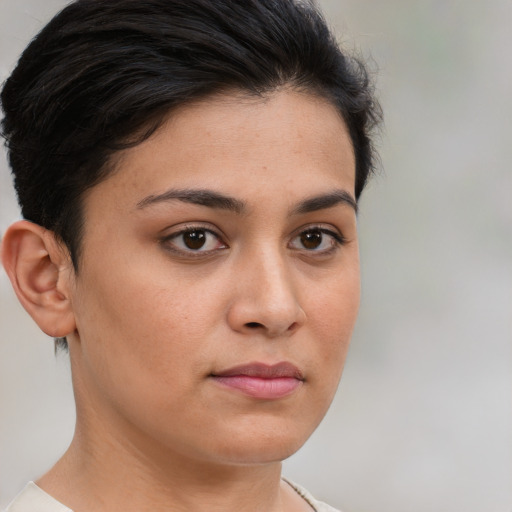 Neutral white young-adult female with short  brown hair and brown eyes