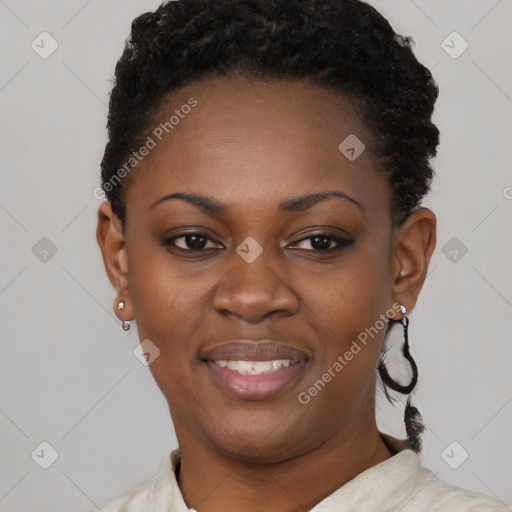 Joyful black young-adult female with short  black hair and brown eyes