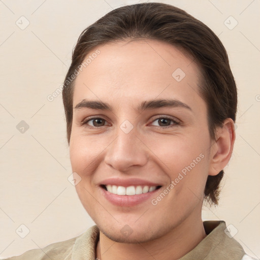 Joyful white young-adult female with short  brown hair and brown eyes