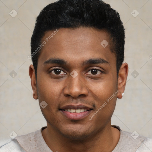 Joyful black young-adult male with short  black hair and brown eyes