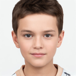 Joyful white child male with short  brown hair and brown eyes