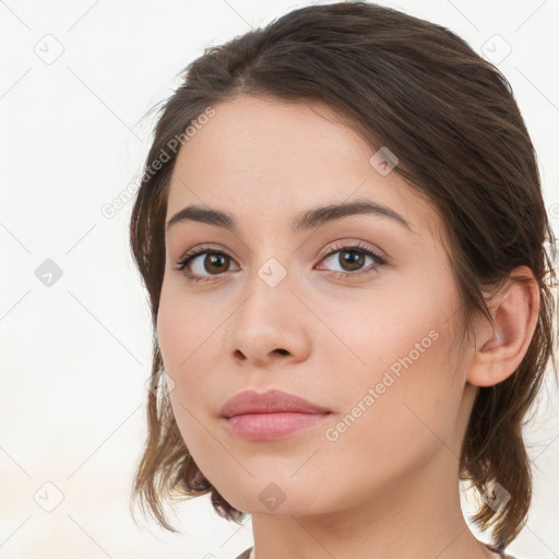 Neutral white young-adult female with long  brown hair and brown eyes