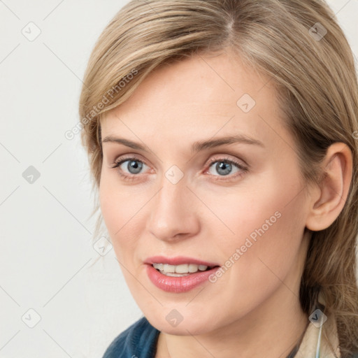 Joyful white young-adult female with medium  brown hair and blue eyes