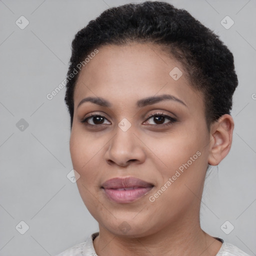 Joyful black young-adult female with short  brown hair and brown eyes