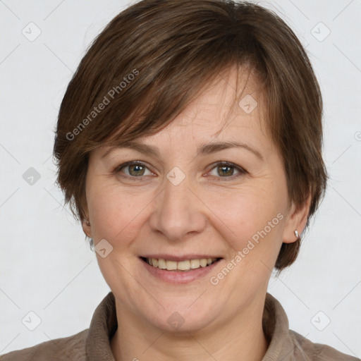 Joyful white adult female with medium  brown hair and grey eyes