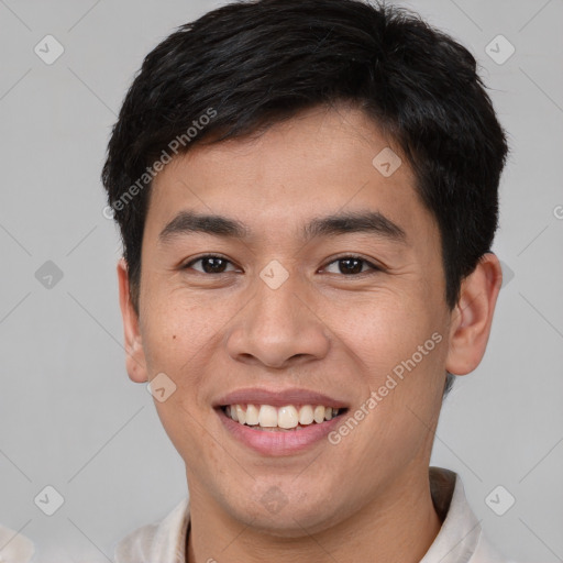 Joyful asian young-adult male with short  brown hair and brown eyes