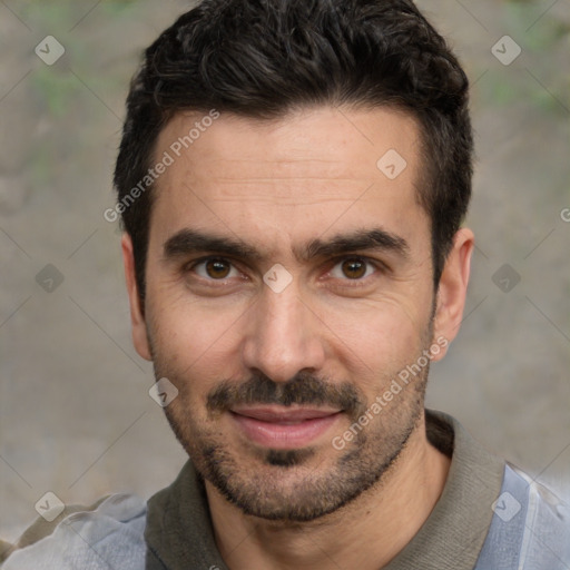 Joyful white adult male with short  black hair and brown eyes