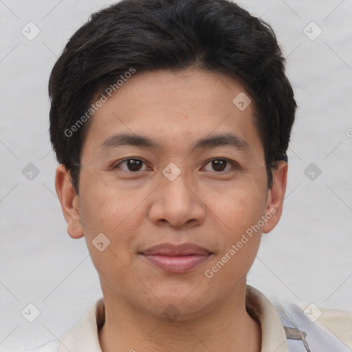 Joyful asian young-adult male with short  brown hair and brown eyes