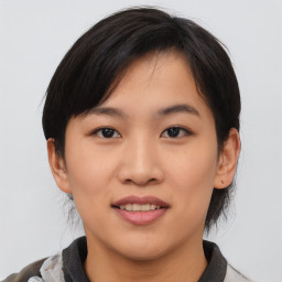 Joyful asian young-adult female with medium  black hair and brown eyes