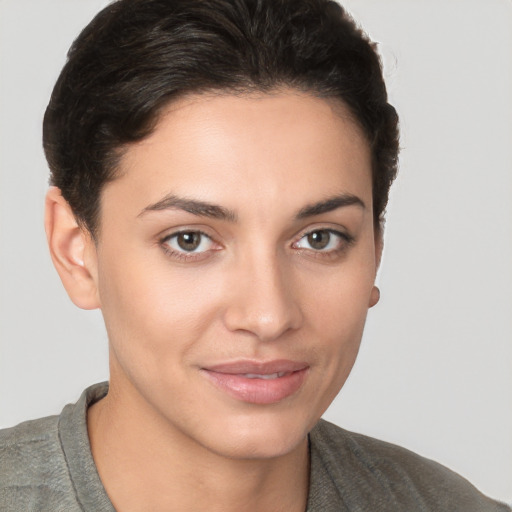 Joyful white young-adult female with short  brown hair and brown eyes