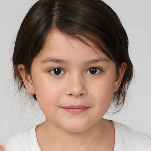 Joyful white child female with medium  brown hair and brown eyes