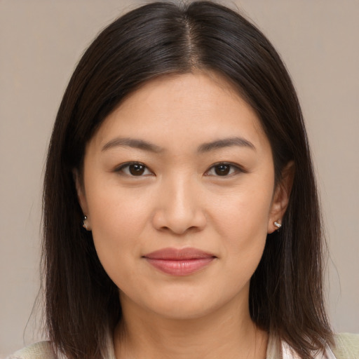 Joyful white young-adult female with medium  brown hair and brown eyes
