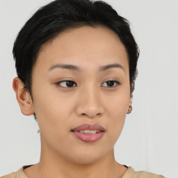 Joyful asian young-adult female with short  brown hair and brown eyes