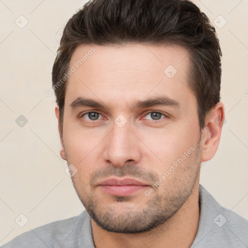 Neutral white young-adult male with short  brown hair and brown eyes